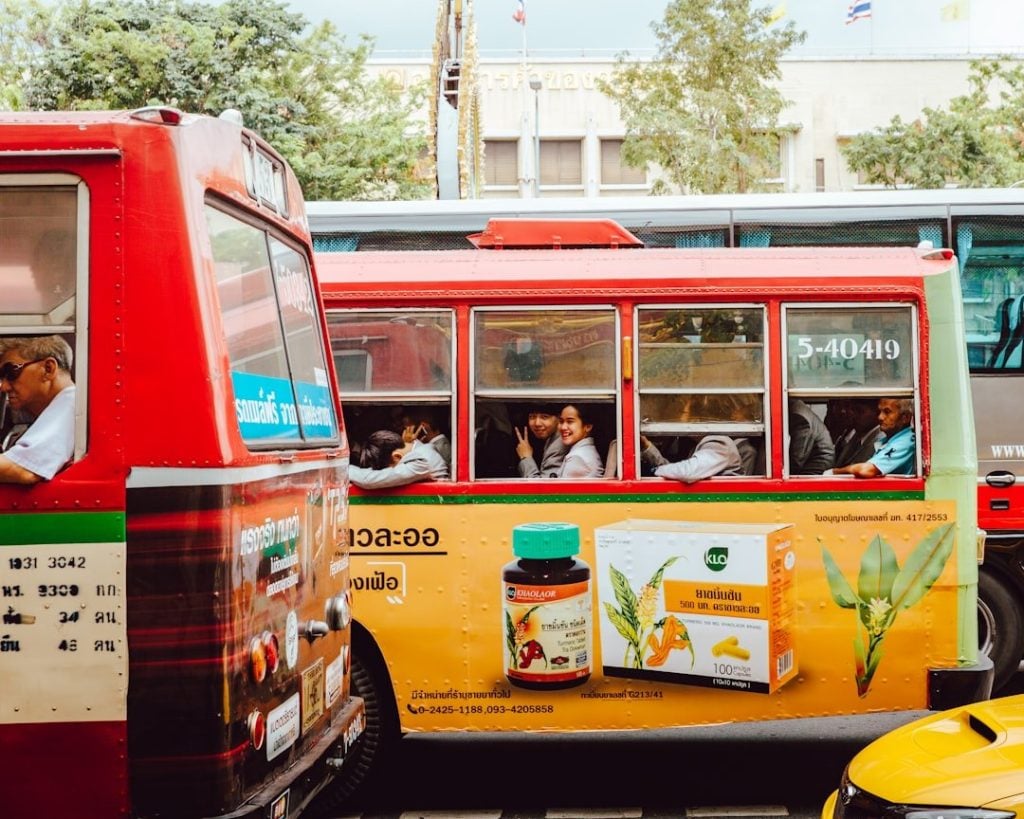 How Fleet Graphics Solutions Enhance Marketing Strategies 3 people riding bus