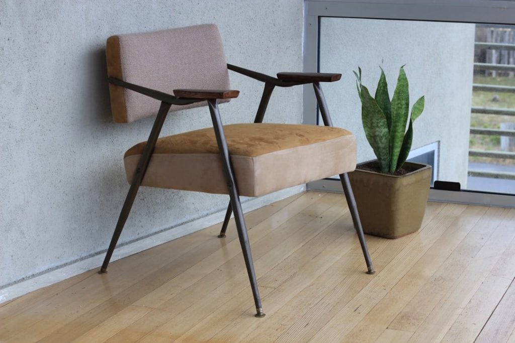 Exploring The Benefits Of Ergonomic Chair Desk Glides 3 brown fabric padded armchair beside green snake plant inside room