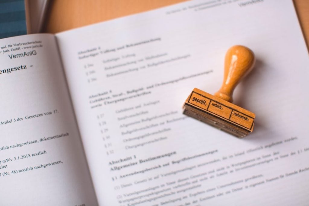 How Businesses Benefit From Accurate Legal Documentation 1 brown wooden hand tool on white printer paper